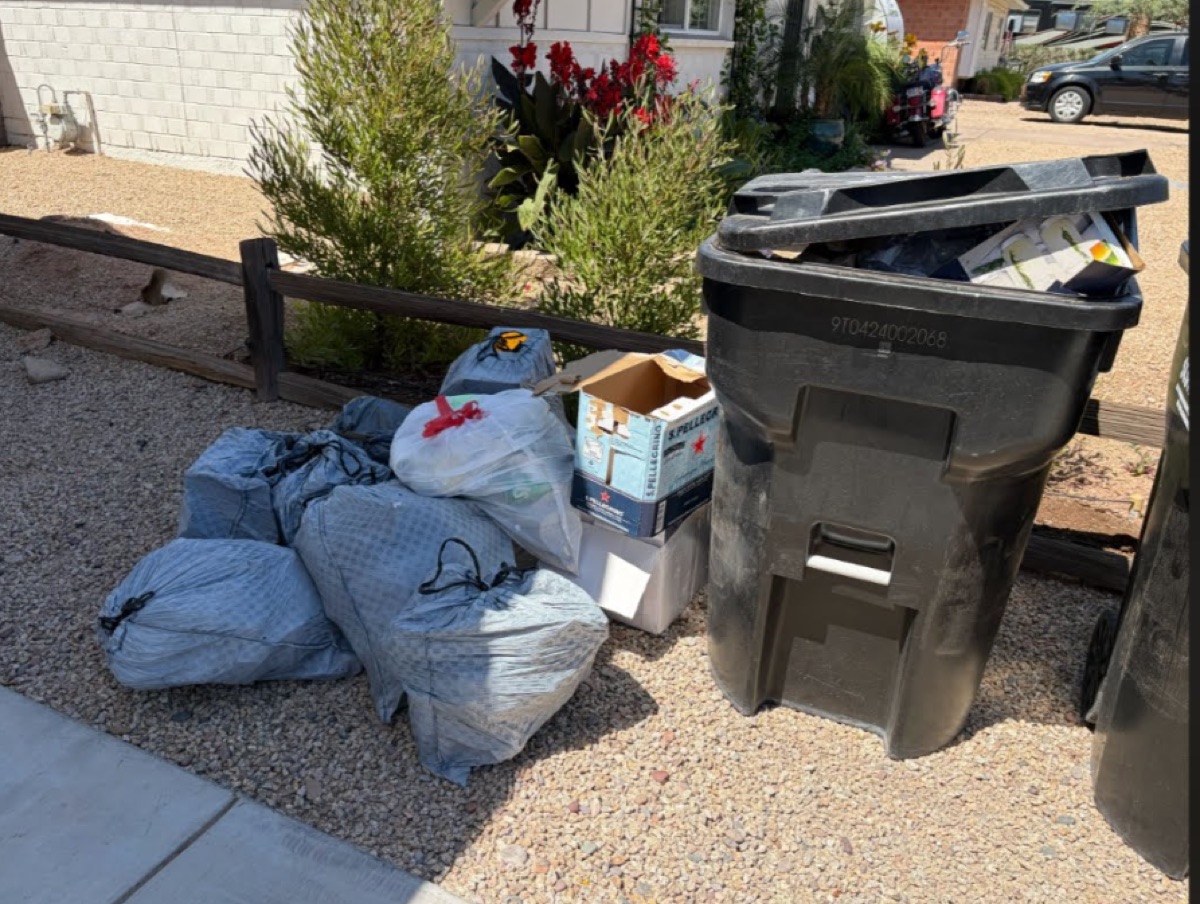 Bags piled next to full bin