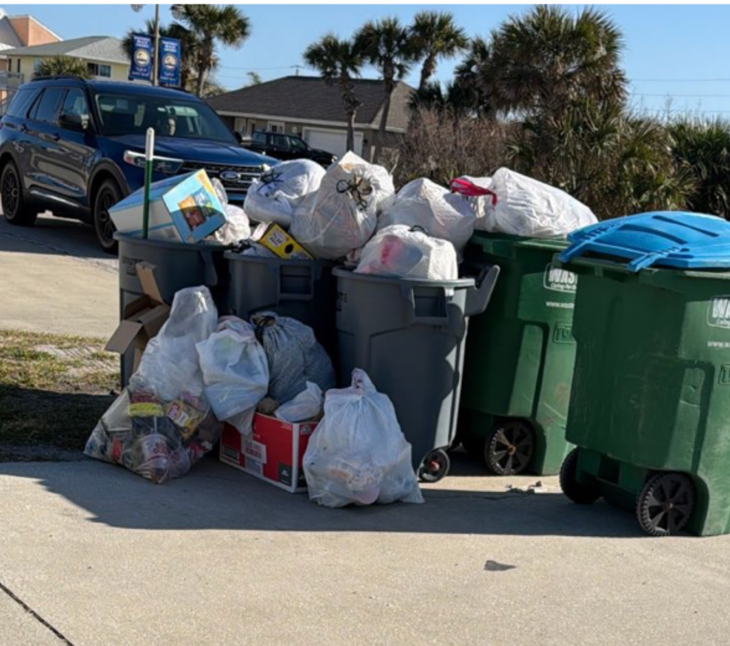 Overflowing trash bins at a rental property